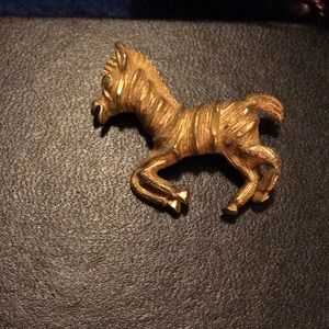 Broach , golden horse with diamond tinting